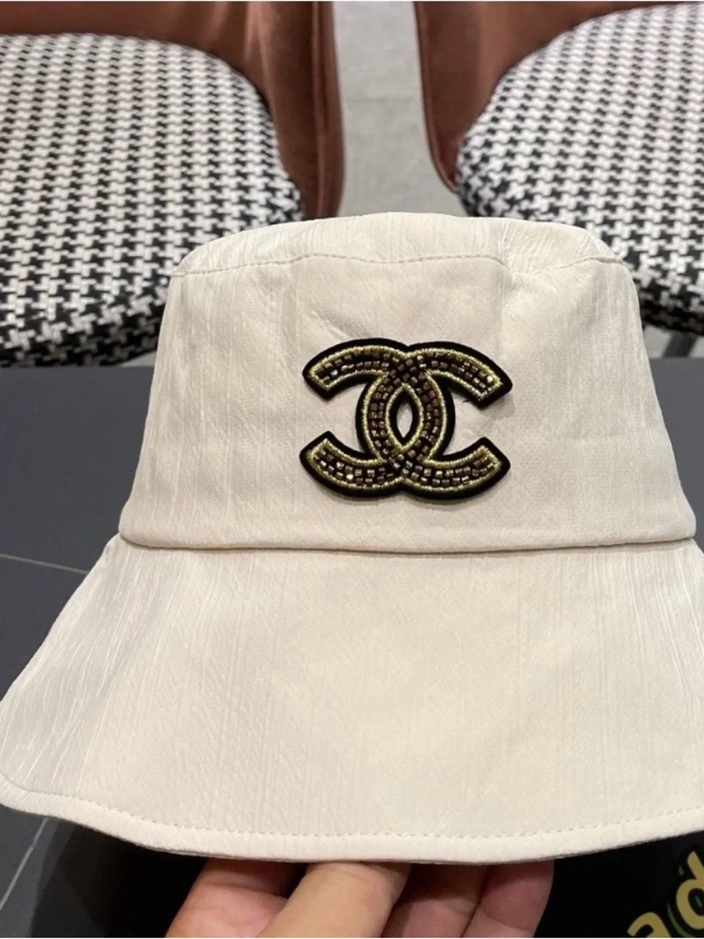 CHANEL Cream Bucket Hat with Black and Gold CC Logo